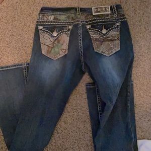 Grace in LA Bootcut distressed camo jeans
